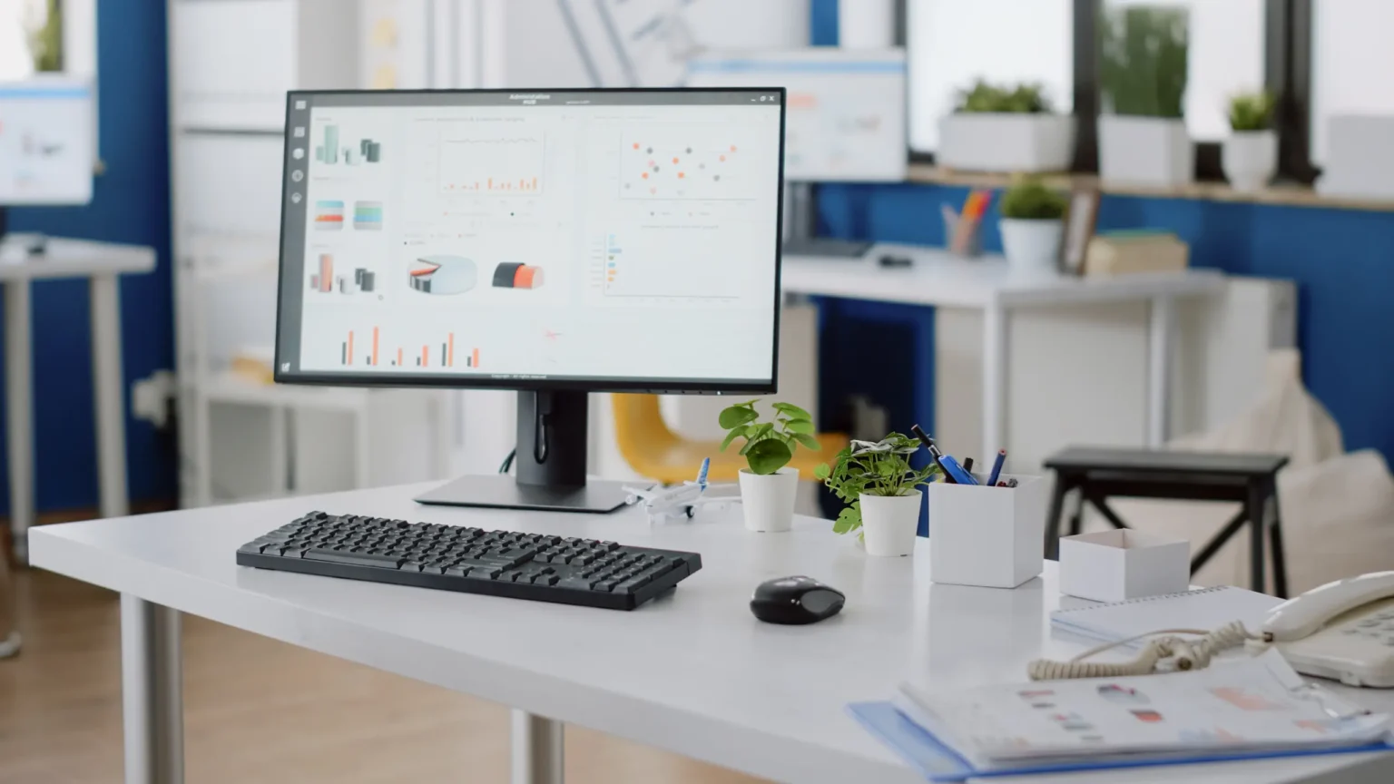 An empty business office desk with a computer monitor